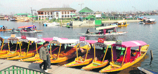 Tourists enjoy shikara rides on the Dal Lake in Srinagar 
