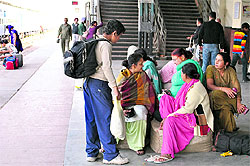 Amritsar-bound passengers wait for the arrival of a train at the Jalandhar railway station on Saturday