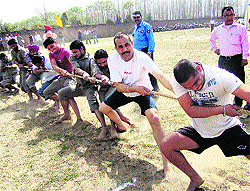 Employees take part in a tug-of-war during the 7th annual athletics meet of the DMCH and Hero DMC organised in Ludhiana on Saturday