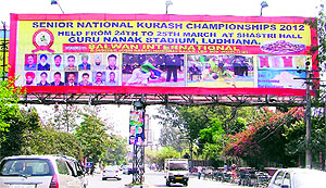 A hoarding put up near Guru Nanak Stadium by the Punjab Kurash Association for the Senior National Championship