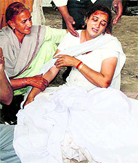 Wailing family members of Rahul Sharma, who was run over by a speeding minibus in Amritsar on Sunday