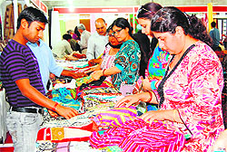 Residents check out a wide range of fabrics