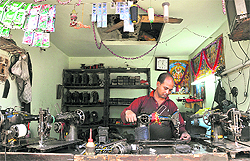 A worker repairing a sewing machine in old city of Ludhiana. 
