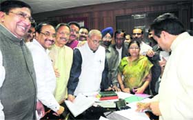 BJP Rajya Sabha nominees Naresh Bansal (left) and Anil Goyal, along with former Chief Minister BC Khanduri, get ready to file their nomination papers in Dehradun on Monday