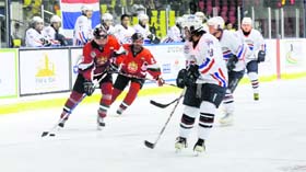 The Kuwait team (in blue) defeated the Chinese Taipei team 12-2 in a match during the IIHF Challenge Cup of Asia in Dehradun on Monday