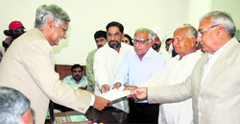 Shadi Lal Batra (third from right), accompanied by Chief Minister Bhupinder Singh Hooda, HPCC chief Phool Chand Mullana and MLA Aftab Ahmed, files his nomination papers for the Rajya Sabha in Chandigarh on Monday.