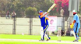 Chief Minister Bhupinder Singh Hooda plays a shot during a cricket match in Gurgaon.