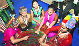 Physically and mentally challenged girls from Apang Kanya Seva Sankul (Manthan) make handicrafts at an exhibition organised by NGO India 2012 in Gurgaon.