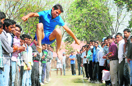 A student participates in the long-jump event at the annual athletics meet of JCD Vidyapeeth in Sirsa.