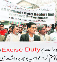 Protesting jewellers demand a rollback of excise duty hike on gold jewellery in Srinagar on Monday. 