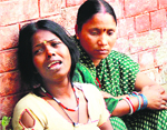 Wailing mother of the child, who was killed in an accident, in Jalandhar