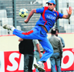 Bangladeshs Mohammad Mahmudullah plays with a football during a training session in Dhaka on Monday. Bangladesh will be looking to beat Sri Lanka to ensure that they go into the final ahead of India.
