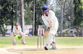 A batsman in action in a match during the 60th Dehradun District Cricket League Tournament in Dehradun on Tuesday