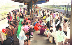 Passengers wait at the Jalandhar railway station for the arrival of trains from Amritsar on Tuesday