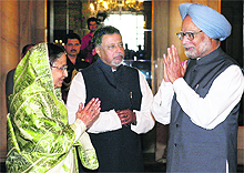 Newly sworn-in Railway Minister Mukul Roy with Prime Minister Manmohan Singh and President Pratibha Patil at the Rashtrapati Bhawan in New Delhi on Tuesday. 