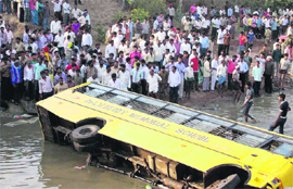 The school bus that plunged into a canal near Tungaram village in Hyderabad on Tuesday. 