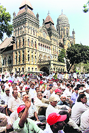 Mill workers stage a protest demanding free housing in Mumbai on Tuesday. 