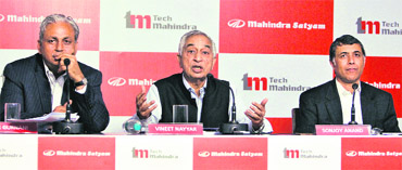 Tech Mahindra CEO Vineet Nayyar (C) addresses a news conference in Mumbai on Wednesday as Mahindra Satyam CEO C.P. Gurnani (L) and Tech Mahindra CFO Sonjoy Anand look on.