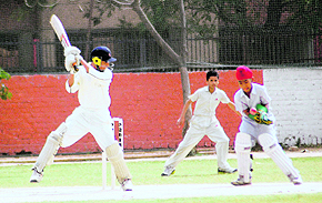 Players in action during a cricket match at Sector 48 in Chandigarh on Wednesday. 