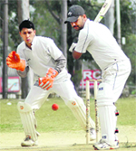 A batsman in action in a match during the 60th Dehradun District Cricket League in Dehradun
