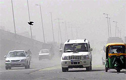 A blanket of dust covers Rajiv Chowk in Gurgaon on Wednesday