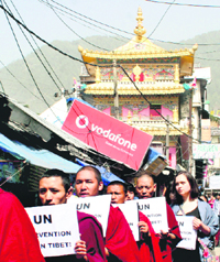 Activists of the Students for a Free Tibet hold a protest in McLeodganj on Wednesday. 