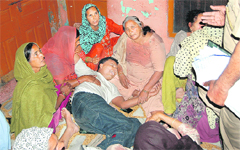 The husband of the deceased wails at his residence at Kot Kalan village on Wednesday. He was later arrested by the police