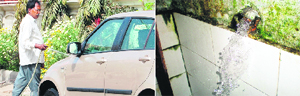 A resident washes his car in this morning and (right) in the absence of a tap, water continues to flow at a public place in Amritsar