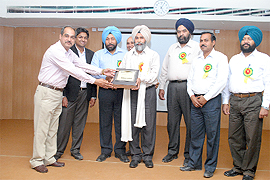 A memento being presented to NS Manshahia.