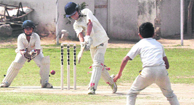 AYPS Mohali batsman play a shot against Sri Cricket Academy Panchkula at the under 13 championship in Chandigarh on Thursday.