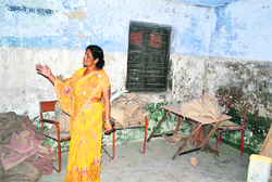 Principal of BHEL Primary School Shashi Bala shows a classroom which is in a dilapidated condition.