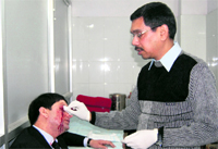 Advocate Ankur Abrol gets treatment at the district hospital in Dharamsala on Thursday.