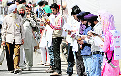 Students take part in a flash mob organised by an NGO to promote reading. 