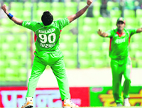 Bangladeshs Nazmul Hossain (L) reacts after the dismissal of Pakistans Younis Khan during the Asia Cup final at the Sher-e-Bangla Stadium in Dhaka on Thursday. Pakistan won the match and the trophy by beating Bangladesh by 3 runs