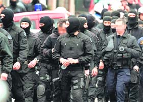 Members of the RAID special force leave the unit after the assault