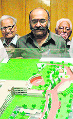 Improvement Trust chairman Sanjiv Khanna shows the project model in Amritsar.