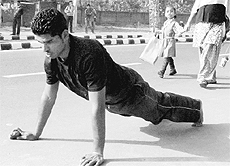 A devotee crawls towards the temple.