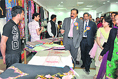 Guests visit stalls at the handloom exhibition at Katra on Friday. 