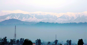 A panoramic view of the snow-capped Trikuta Hills captured from Hiranagar in Jammu.