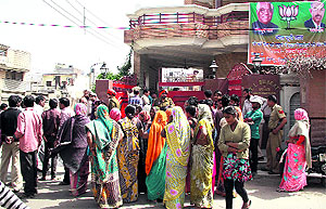 Jhuggi dwellers hold a protest outside the residence of Local Bodies Minister Bhagat Chunni Lal in Jalandhar on Friday