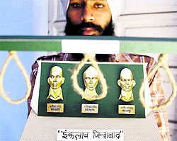 An artist, Gurpreet Singh, with his creation to pay tributes to martyrs Bhagat Singh, Sukhdev and Rajguru, in Amritsar on Friday; (right) Chief Minister Parkash Singh Badal addresses a gathering at Khatkar Kalan