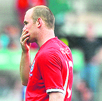 Wayne Rooneys stray shot accidentaly broke a fans wrist.