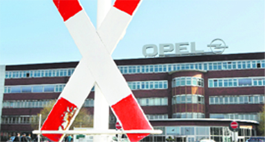 A warning sign in front of General Motors' Opel plant in Bochum, Germany. Opel managers will present a business plan on Wednesday that likely will involve reducing capacity by some 30% through the closure of two car plants in Europe.