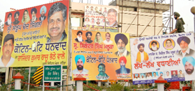 Hoardings felicitating newly-elected MLAs deface the Fauji Chowk, an important landmark in Bathinda.