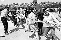 Staff and former students of Yadavindra Public School take part in a tug-of-war in Mohali on Saturday
