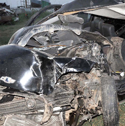 The mangled remains of a Chevrolet Spark car which met with an accident at GT Karnal Road near Mukarba Chowk. A woman died while her husband and two children were seriously Injured in Delhi