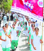 Nurses hold an awareness rally on the occasion of World TB Day in Karnal