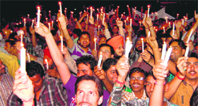 Members of the Bullion and Ornament Merchant Association hold a candlelight march to protest against the Centre in Amritsar on Saturday.