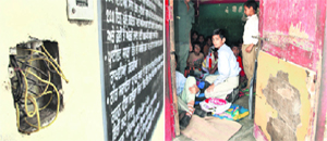 A torn switchboard and a makeshift wooden board used to fix the door at Government High School in Kishanpura are proof of hooliganism of locality boys.