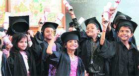 Kindergarten students of St Soldier School show their roll of honour as they graduate to primary sections in Jalandhar on Saturday.
